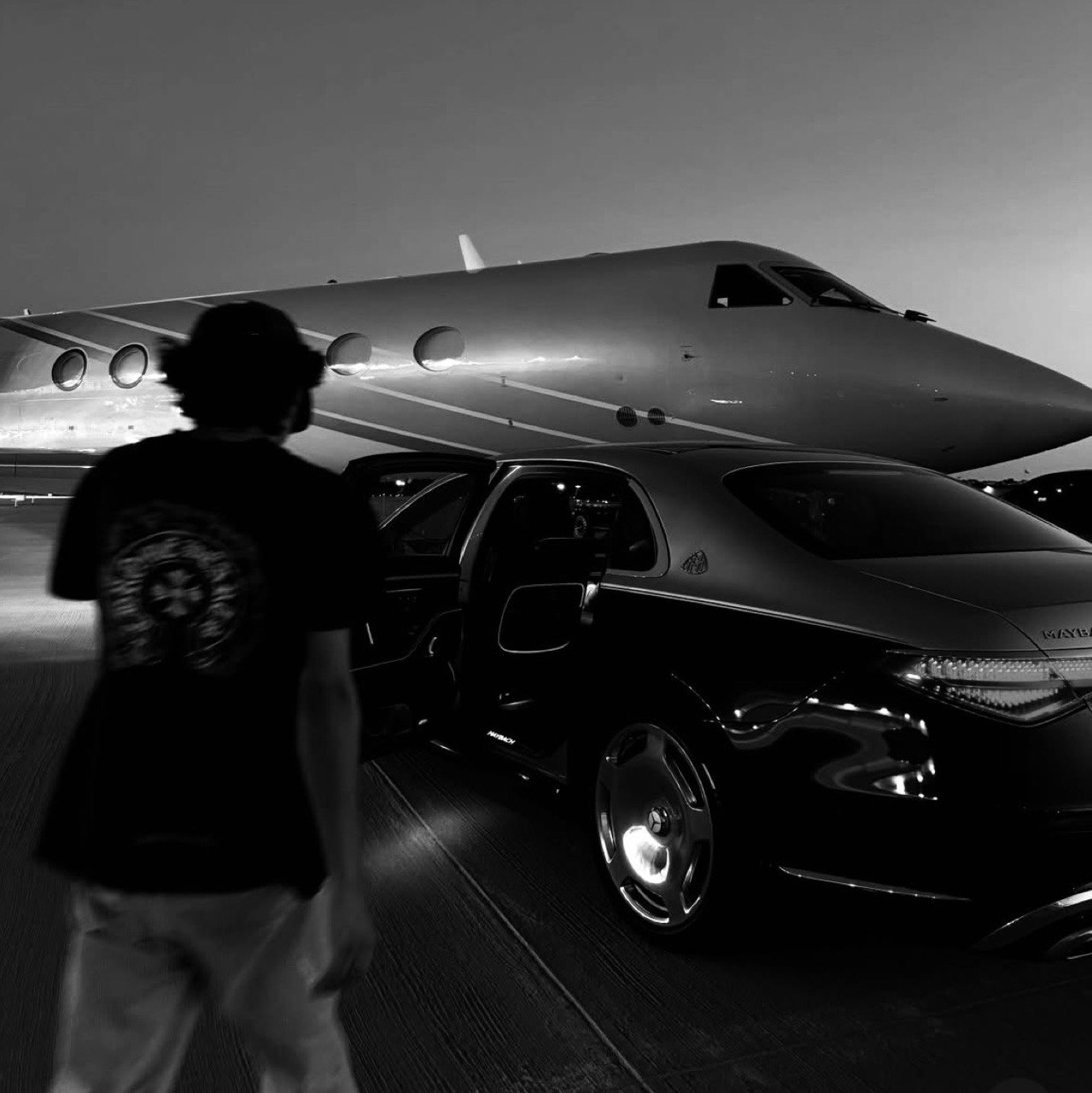 Private jet and Maybach on the tarmac